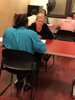 photo of Cordelia assisting a Doe Fund client